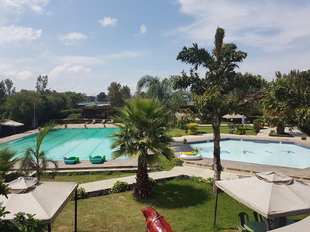 outdoors, pool side, two swimming pools, kivu resort