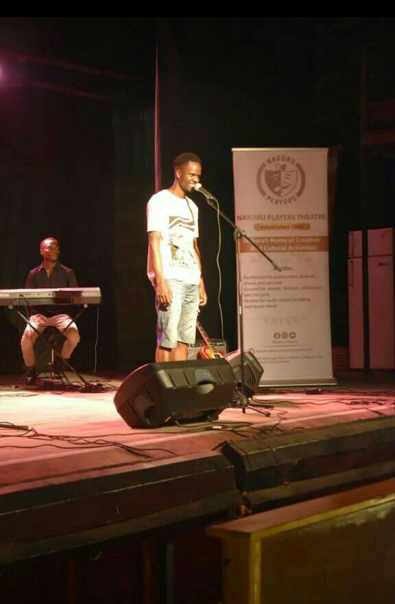two guys, on a stage, singing, at nakuru players theatre